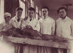 One of a set of French gelatin silver prints showing an autopsy at the Institut Médico-Légal on the Quai de la Rapée, Paris, in March 1924. wow, they arent even using gloves.