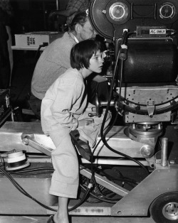 chelsearaesforest:  Checking things out. Mary Badham on the set of To Kill A Mockingbird. 1962.
