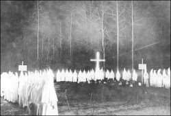 An extremely rare view of a Ku Klux Klan meeting at night in Union County, Arkansas, in the 1920s. The Klan&rsquo;s resurgence in the 1920s partially stemmed from their role as the extreme militant wing of the temperance movement. In the lawless oil boomt