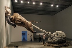 prguitarman:  sixpenceee:  Chen Wenling’s sculpture shows a bull, meant to represent Wall Street, seen ramming the biggest con man of all time, Bernie Madoff, into a wall. The huge cloud coming out of the bull’s rear not only refers to the end of
