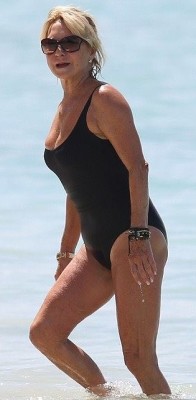 I love black one piece suits on mature women especially if there is no lining in the crotch allowing for a DEEP cameltoe.