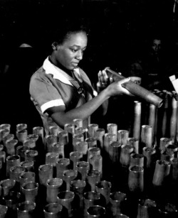 deweydell25:  Here’s a great 1940s photo of 21 year old,Bertha Stallworth.  Miss Stallworth is shown inspecting the end of a 40 mm artillery cartridge case at Frankford Arsenal (Pennsylvania) ,during WW2. She was one of many African American women who