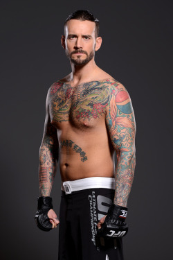 thepunknation:UFC Photoshoot Part Two‘DALLAS, TX - MARCH 13:  Phil ‘CM Punk’ Brooks poses for a photo during a UFC photo session at the Hilton Anatole Hotel on March 13, 2015 in Dallas, Texas. (Photo by Mike Roach/Zuffa LLC/Zuffa LLC via Getty