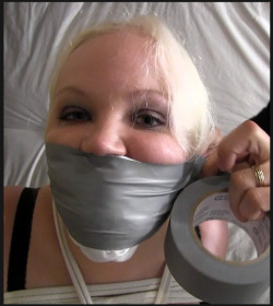 slavefarmer:  Mouth-stuffing ducttape-gagging jobs don’t get much more thorough than this. Kudos, colleague Slave-Catcher 
