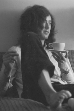  Jimmy Page sits barefoot (probably in a hotel room) with cup of tea during the band’s second American tour, May 1969. 