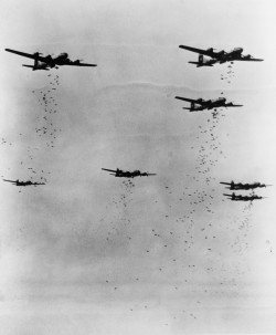 wwii-bombers:    B-29 Superfortress bombers dropping bombs on Japan  