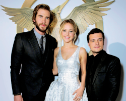 mockingjaysource:  Jennifer Lawrence, Liam Hemsworth and Josh Hutcherson attend the premiere of Lionsgate’s “The Hunger Games: Mockingjay - Part 1” at Nokia Theatre L.A. Live on November 17, 2014 in Los Angeles, California. 