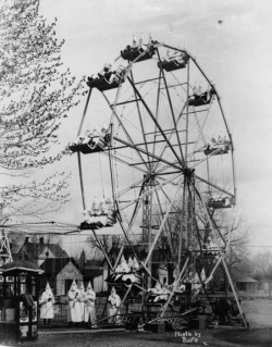 polarity-princess:  Possibly one of the most oxymoronic pictures ever taken.  The Ku Klux Klan are one of the most extremist hate groups in America but here they are experiencing a day out at a carnival in Greenwood, Colorado in April 1928. 