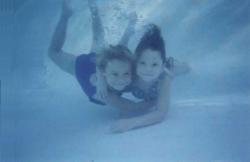 me and le sister as kids. natural born fish, we never needed swimming lessons