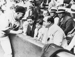historicaltimes:  Al Capone in the front row of a White Sox-Cubs charity game, 1931 