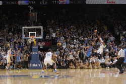 nba:  Andre Iguodala #9 of the Golden State Warriors makes the game winner against Thabo Sefolosha #25 of the Oklahoma City Thunder on November 14, 2013 at Oracle Arena in Oakland, California. (Photo by Rocky Widner/NBAE via Getty Images)