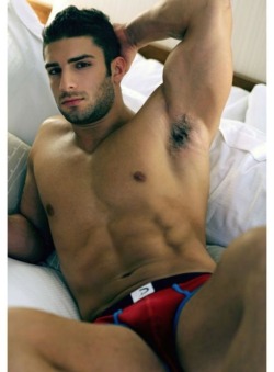 forcuriousguys:  Dark eyes looking over a hard body. Follow Guy Curious for more like this.