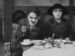chaplin-images-videos: Charlie Chaplin &amp; Edna Purviance in The Immigrant (1917) https://painted-face.com/