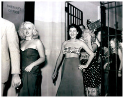 Vintage press photo dated from August of ‘49 features Miami vice officers escorting a group of dancers thru police headquarters.. All were arrested at Helene Polka’s infamous &lsquo;JUNGLE CLUB’; including (at Extreme Right) featured performer: