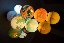 asylum-art:  Globe Chandelier byBenoît Vieuble This gorgeous glowing globe chandelier by Benoît Vieubled is totally rocking our world right now. Composed of 15 spinning spheres of Earth, the planetary constellation is made of repurposed desk globes