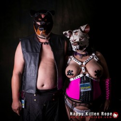 twistedpupfl:  Me and wife at fetishcon