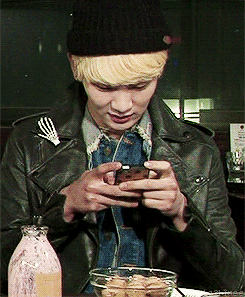  Key was busy on his phone (texting), while everyone else was laughing.     