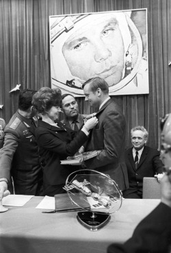 collectivehistory:  Valentina Tereshkova, first woman in space, meets Neil Armstrong, first man on the moon, in 1970.  