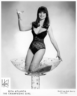 Rita Atlanta     aka. “Miss International”.. Very late-period promotional photo, featuring her signature Champagne Bath glass..