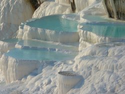 earth-phenomenon:  Pamukkale, 19 km (12 miles) north of Denizli, is Turkey’s foremost mineral-bath spa because of its natural beauty: hot calcium-laden waters spring from the earth and cascade over a cliff. As they cool they form dramatic travertines