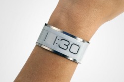 E-Ink Thinnest Watch - as thin as a credit card. It charges for 10 minus, lasting for a month on a single charge. Kickstarter page and more information here