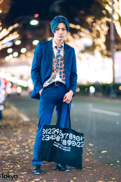 tokyo-fashion:  17-year-old Japanese student Kosei on the street in Harajuku with blue hair and a matching blue suit, a floral vest, Comme Des Garcons necktie, Comme Des Garcons tote bag, and Allen Edmonds shoes. Full Look