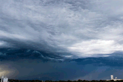 cubebreaker:  Storm chaser Alex Schueth captured a time-lapse photo of a rare cloud formation known as undulatus asperatus, where dark clouds appear to roll across the sky like fierce ocean waves.