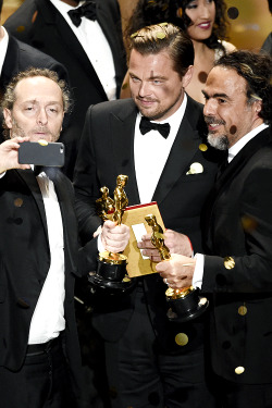 mcavoys:    Emmanuel Lubezki, Leonardo DiCaprio and Alejandro G. Inarritu take a selfie on stage at the concussion of the show at the Oscars on Sunday, Feb. 28, 2016, at the Dolby Theatre in Los Angeles.   