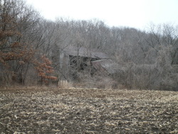 fuckyeahabandonedplaces:  Abandoned collapsing barn and farm buildings. Someone still works the land, but, no one lives there. 