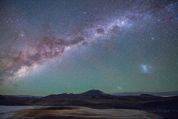 the-future-now:  Galaxies from the Altiplano  Explanation:   The central bulge of our Milky Way Galaxy rises over the northern Chilean Atacama altiplano in this postcard from planet Earth.  At an altitude of 4500 meters, the strange beauty of the desolate