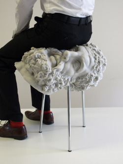 drakebarmitzvah:archatlas:Soft Hercules FAT ArchitectureSoft Hercules is a stool cast from foam rubber - the soft squishy stuff that is usually used to make stress balls. The bust of Hercules, usually something solid both in its material and the culture