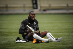 footballistic2:  Massadio Haidara puts on his boots whilst sitting on the pitch during a Newcastle United Training Session at The Newcastle United Training Centre on January 15, 2015, in Newcastle, England. (Photo by Serena Taylor/Newcastle United via