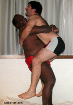 wrestlerswrestlingphotos:  black daddy bearhugging slave boy 