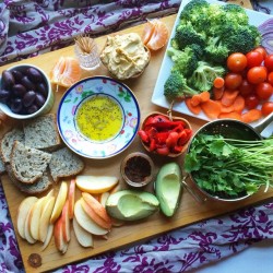 time-flies-so-high:  happyvibes-healthylives:  Had myself a random smorgasbord dinner- apples, oranges, olives, roasted peppers, avocado, hummus, garlic confit, fresh herbs, ️raw veggies, fresh bakery bread and olive oil w/herbs to dip.   This looks