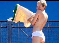 thewomanwatcher:  Miley Cyrus was caught sunbathing topless at a luxury hotel in Sydney, Australia…