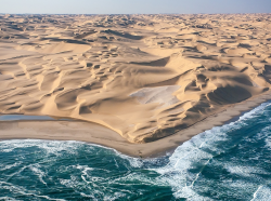 sixpenceee:  This is where the Namib desert meets the Atlantic ocean. 