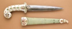 lookswhosetalkin:   Mughal Dagger  Dated: circa 1675-1700 (sheath fittings, circa 1800)Culture: Indian, Mughal Medium: white nephrite jade hilt and sheath fittings inlaid with foiled rubies, emeralds, and diamonds set in gold; steel blade; velvet covered