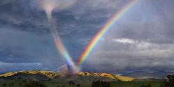 wild-guy:  classy-and-glamorous-babe:  &ldquo;A friend took this pic in Arizona USA. The meteorologists don’t have a name for it.  Seems to be high energy to be in a Rainbow and a tornado! ”  Gaynado 