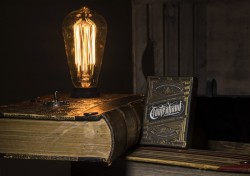 asylum-art:Contraband Book Lamp &amp; Playing CardsDesigned in London by Joe White and produced by Theory11, Contraband Playing Cards were inspired by secret societies, conspiracy theories, and everything unknown. Contraband Playing Cards were inspired