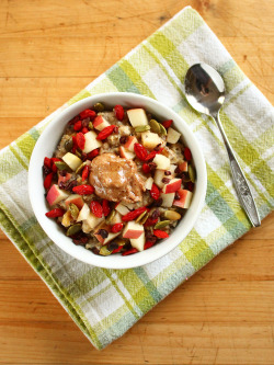 garden-of-vegan:  Loaded trail mix oats (quick oats cooked in water with chia seeds, maple syrup, chopped apple, walnuts, and vanilla soy milk) topped with almond butter, apples, pumpkin seeds, goji berries, and cacao nibs,  GAG!!!!