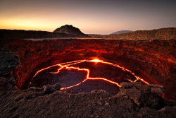 fameorbust: sixpenceee:  The lava lake of the continuously active volcano Erta Ale, Ethiopia. (Source)  Someone throw me in it 