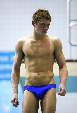 sfswimfan: This sexy diver doesn’t look very happy.  However, with that low-cut speedo and that thick 2:00 vpl (dare I wonder if he’s cut?), not to mention the chiseled chest, hot v-line, sexy arms, and so on…. I have to say I’m pretty happy