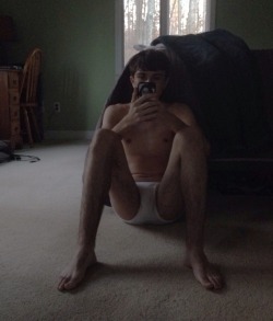 dodgecaliber2007:  Sitting on the floor next to his bed texting his roommate begging him to unlock the chastity cage that he locked his penis in.  His roommate locked up his dick because he was tired of asking him to not jerk off in the common areas