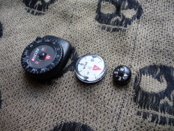 ru-titley-knives:  Recta strap compass, Silva GITD compass, 10mm micro SERE compass.  the larger Recta compass http://www.recta.ch/en/clipper generally lives on my Kifaru E&amp;E shoulder strap, Ive just been givern the GITD Silva one from My Mate Alex 