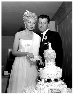 In Las Vegas, Lili St. Cyr cuts the wedding cake with husband #5: Ted Jordan.. 