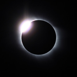 ikenbot:   The Diamond Ring Effect  The Baily’s beads effect is a feature of total solar eclipses. As the moon “grazes” by the Sun during a solar eclipse, the rugged lunar limb topography allows beads of sunlight to shine through in some places,