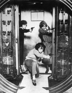 updownsmilefrown: Female workers practice protecting the main vault of the strong room at the Cleveland Trust Company, Ohio, 1924, in the early days of Al Capone and ‘Bugs’ Moran 