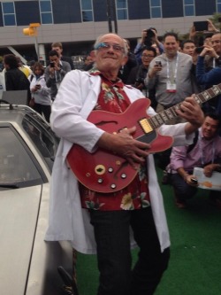 memeguy-com:  Christopher Lloyd next to a DeLorean wearing Google Glass and playing Marty McFlys Gibson from CES yesterday 