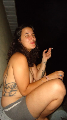 Smoking naked on the roof.