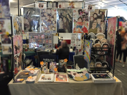 Table layout Fanime 2015 :3I took this Monday so I was already sold out of most of the totes, but I managed to order enough of everything else~ Also I am finally running out of some of the old doodlebooks, dang those things last forever D: I didn’t